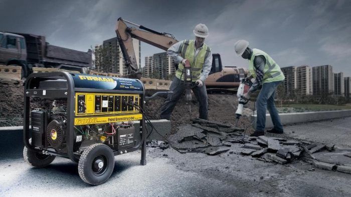 Groupe électrogène alimentant deux marteaux piqueurs sur un chantier